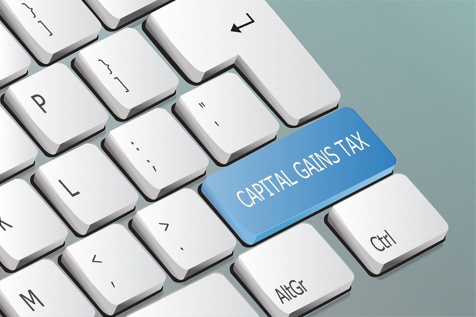 Buy-to-Let Capital Gains Tax. Keyboard with white keys and a blue shift key showing the words Capital Gains Tax
